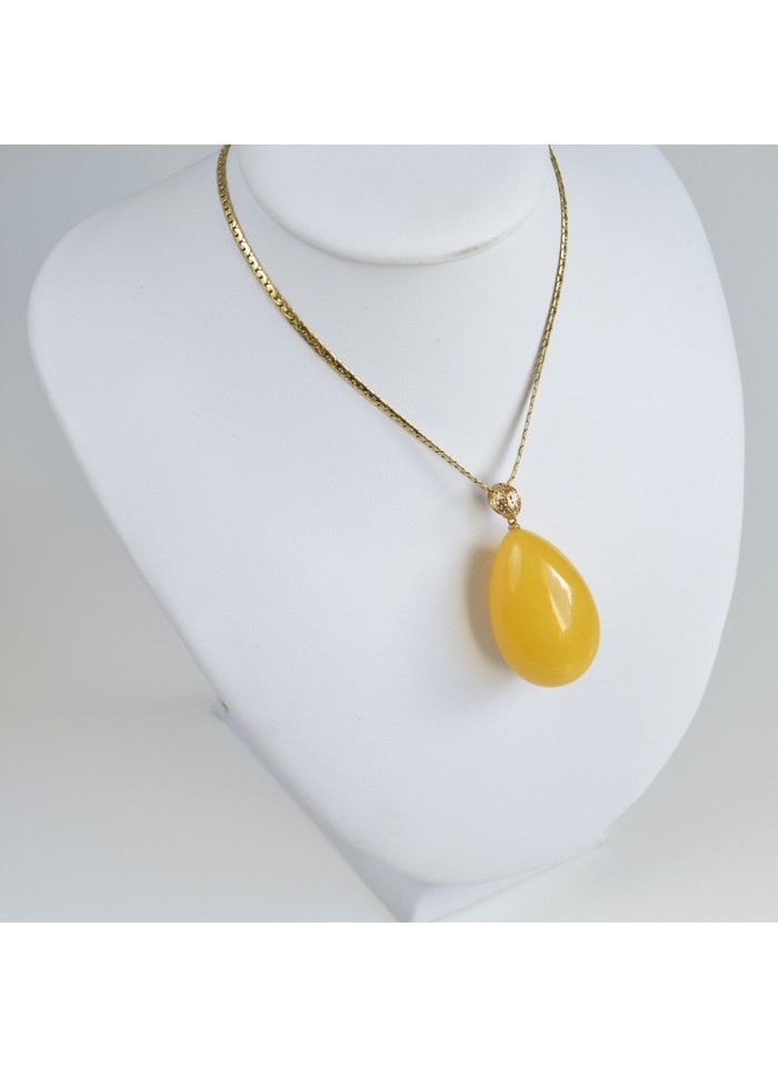 amber and gold pendant